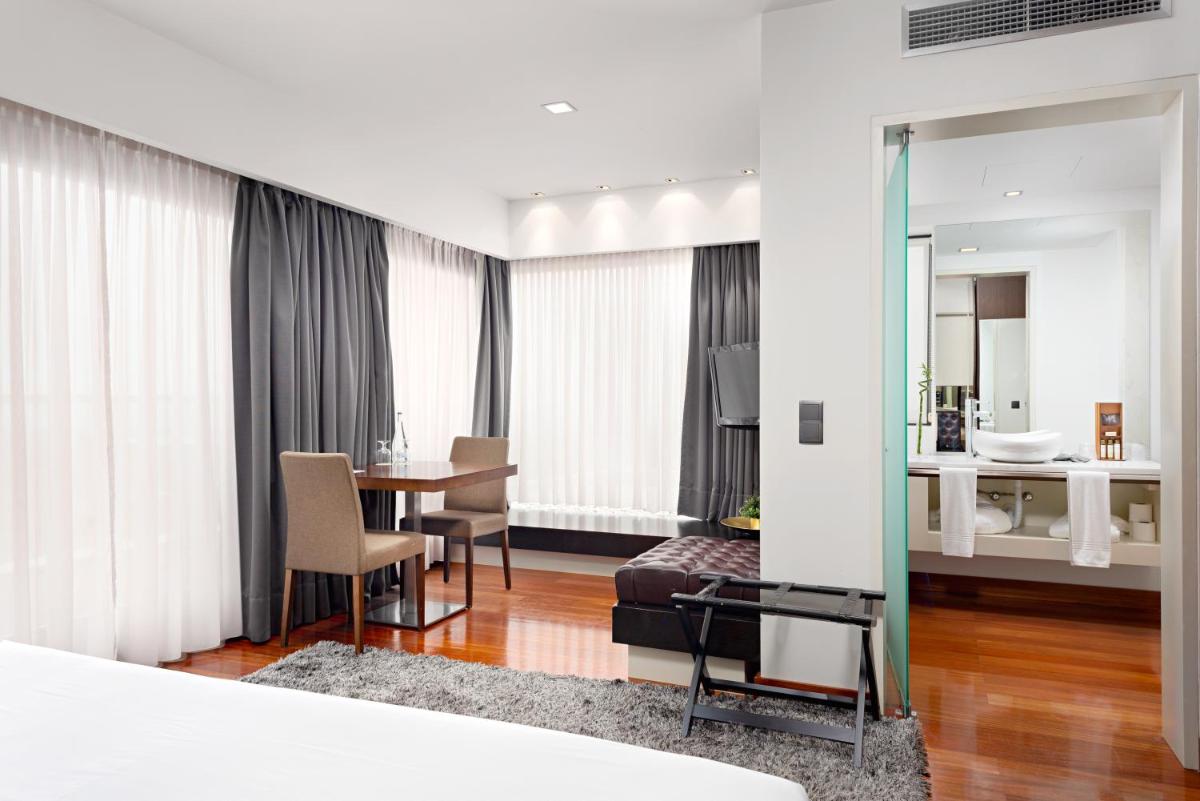 Uma cama ou camas num quarto em Hotel dos Zimbros