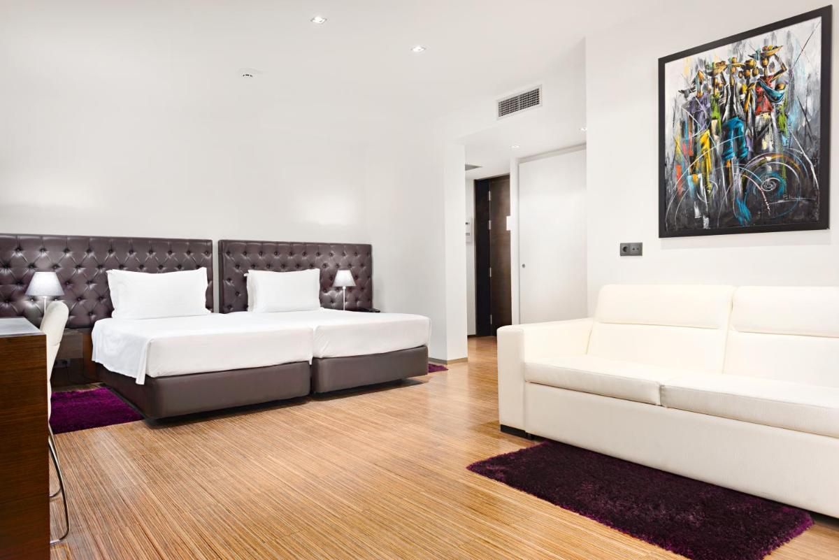 Uma cama ou camas num quarto em Hotel dos Zimbros