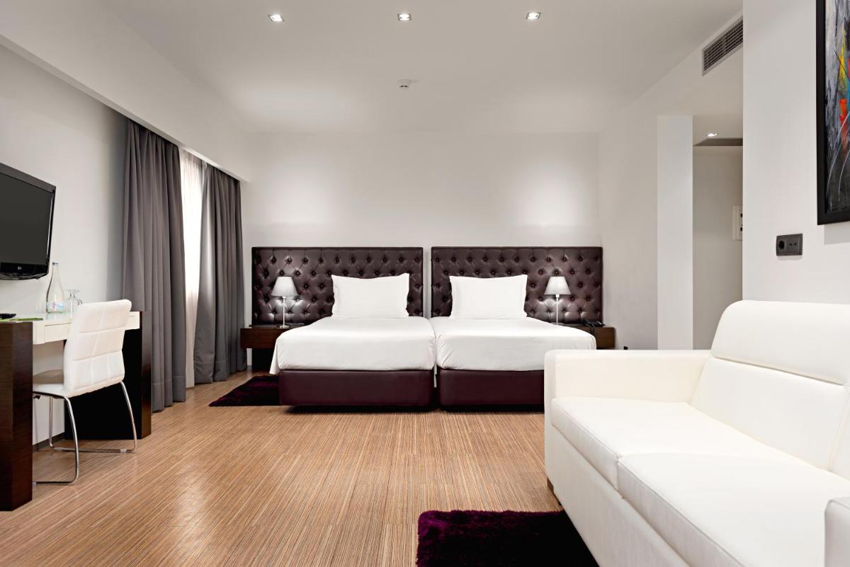 Uma cama ou camas num quarto em Hotel dos Zimbros