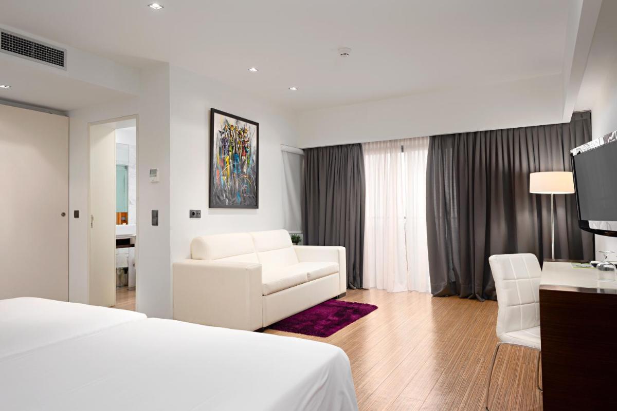 Uma cama ou camas num quarto em Hotel dos Zimbros