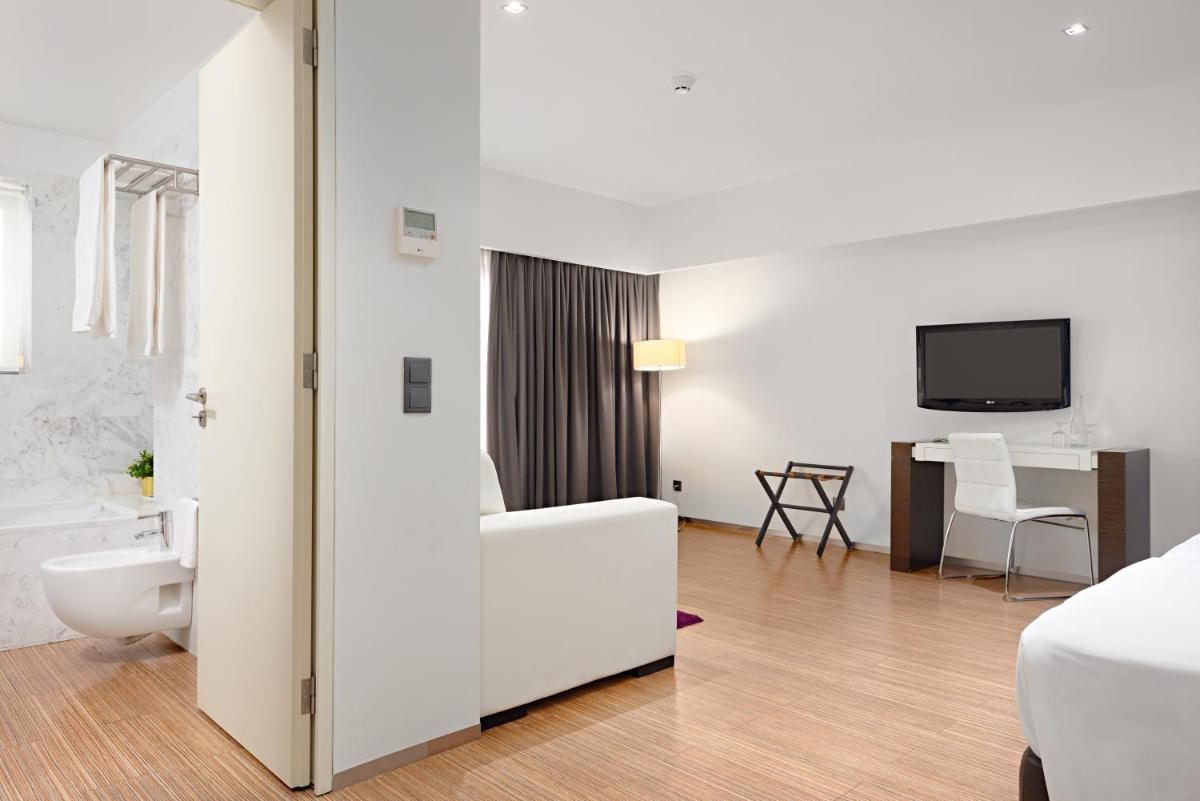 Uma cama ou camas num quarto em Hotel dos Zimbros