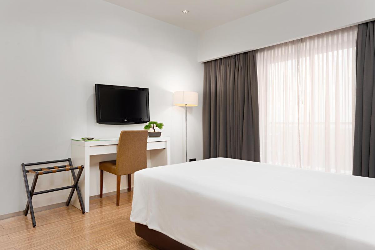 Uma televisão e/ou sistema de entretenimento em Hotel dos Zimbros