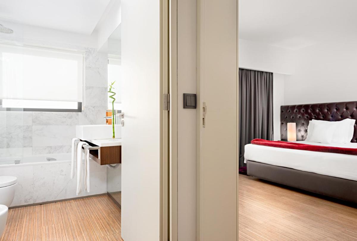 Uma cama ou camas num quarto em Hotel dos Zimbros