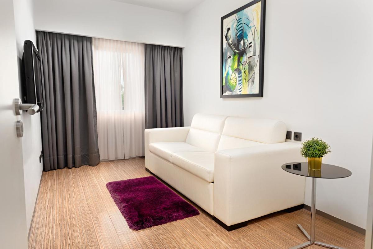 Uma cama ou camas num quarto em Hotel dos Zimbros