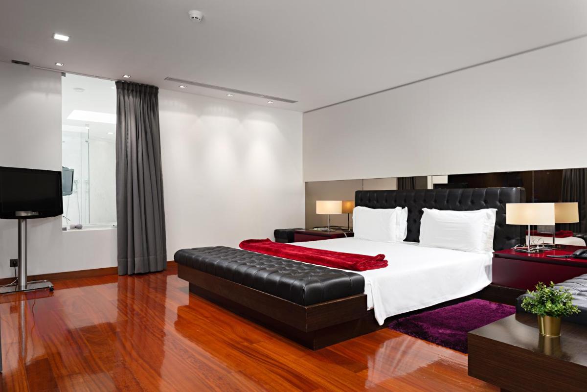 Uma cama ou camas num quarto em Hotel dos Zimbros