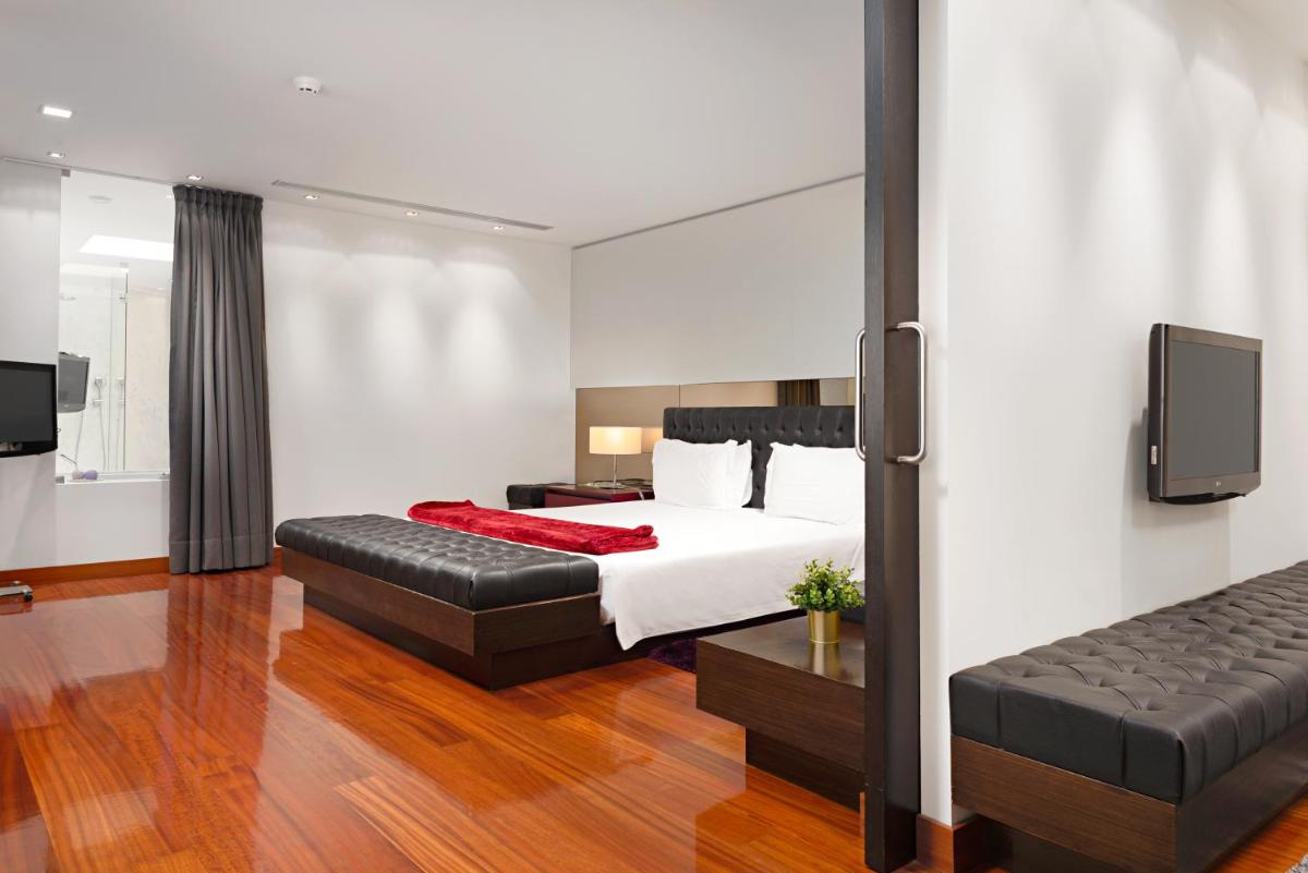 Uma cama ou camas num quarto em Hotel dos Zimbros