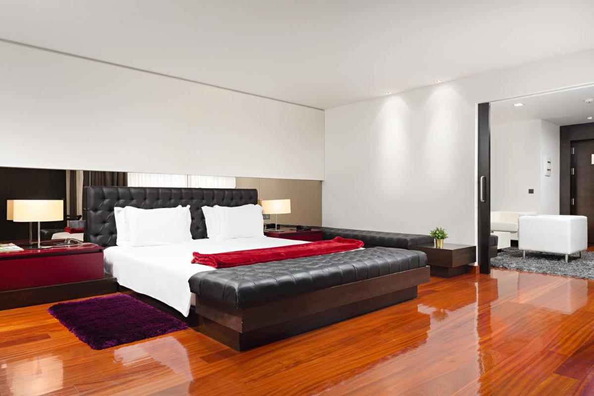 Uma cama ou camas num quarto em Hotel dos Zimbros