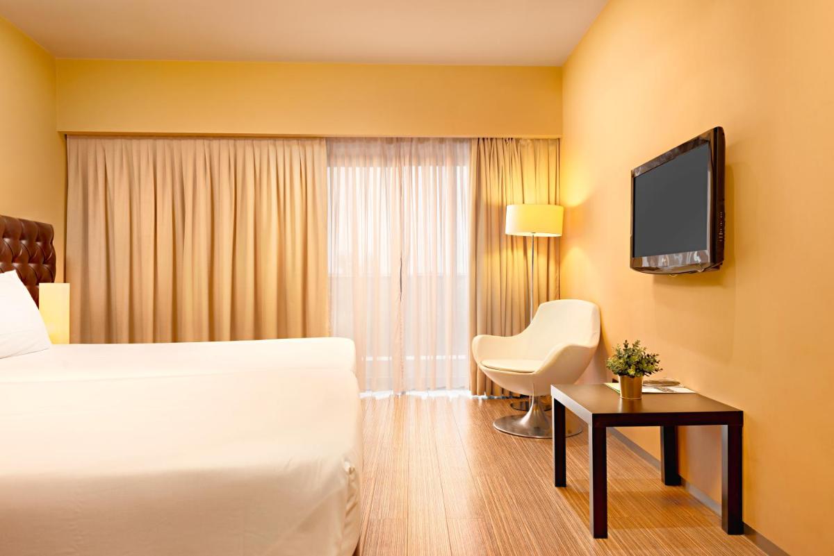 Uma televisão e/ou sistema de entretenimento em Hotel dos Zimbros
