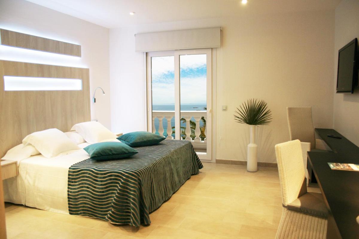 Cama o camas de una habitación en Hotel Vistabella