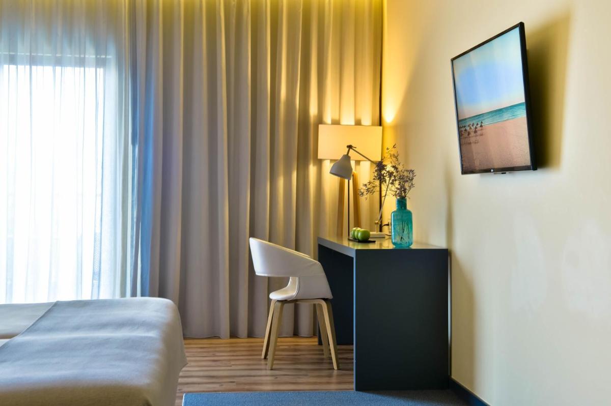 Uma cama ou camas num quarto em The Prime Energize Hotel & SPA - Algarve