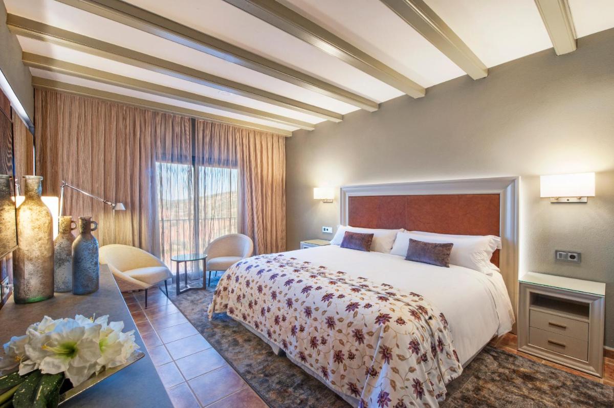 Cama o camas de una habitación en Hotel La Caminera Club de Campo