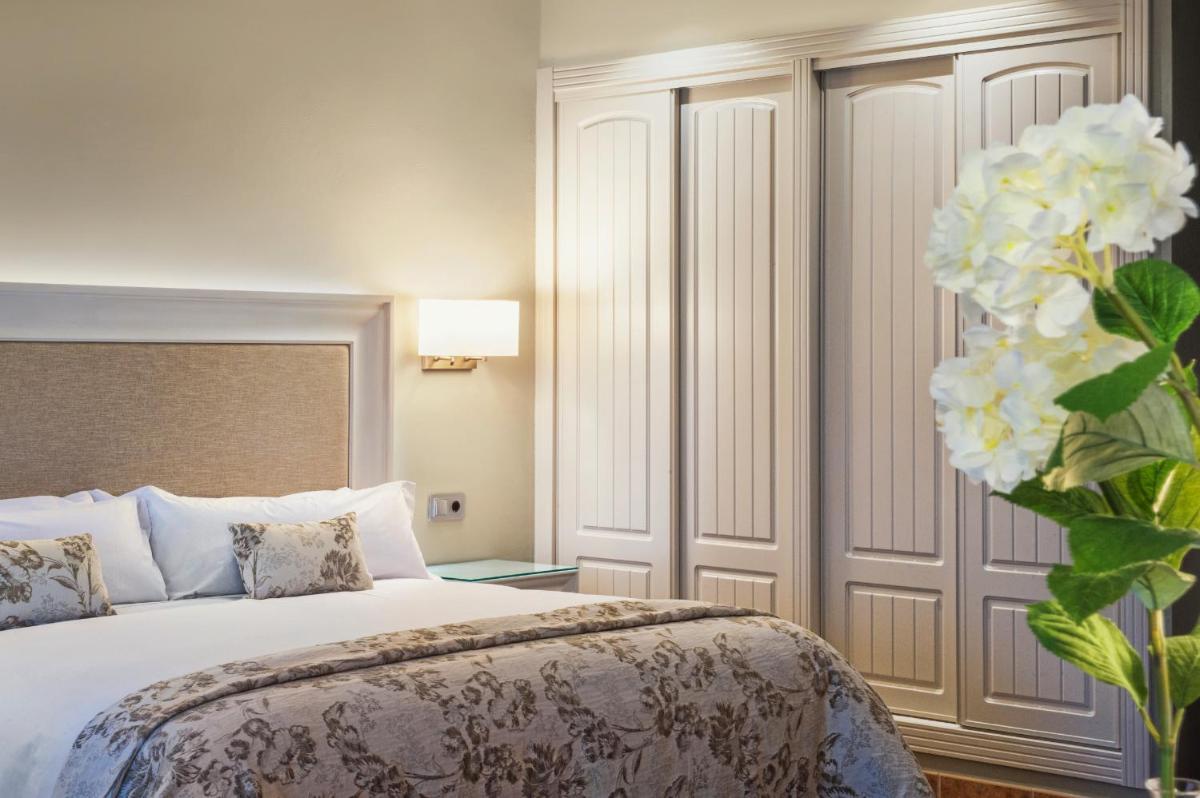 Cama o camas de una habitación en Hotel La Caminera Club de Campo