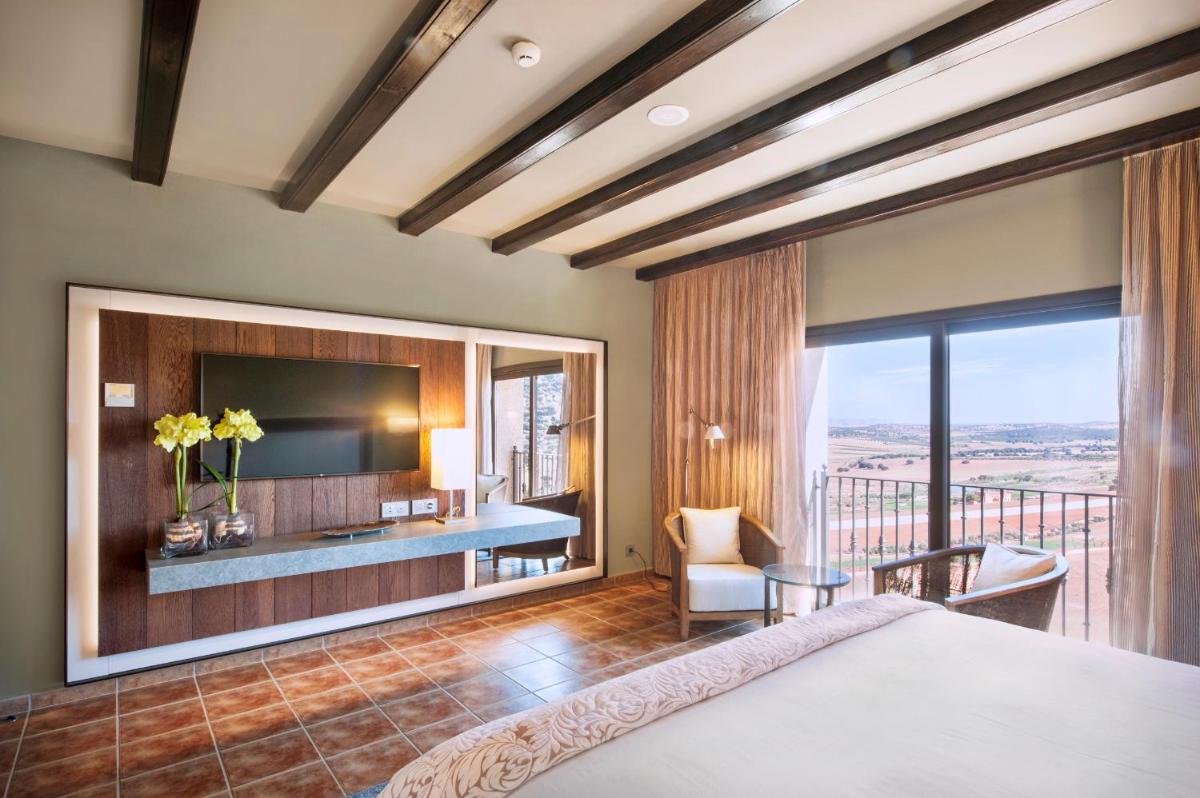 Cama o camas de una habitación en Hotel La Caminera Club de Campo
