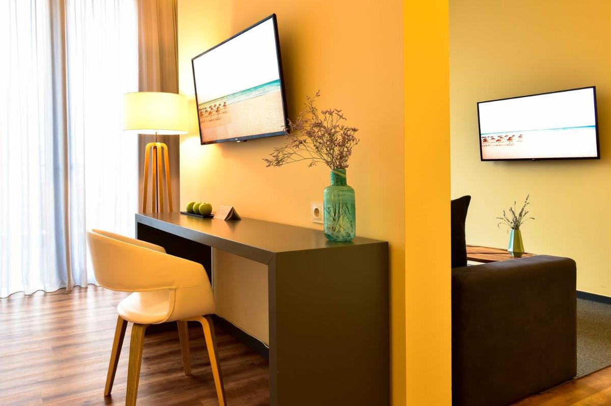 Uma televisão e/ou sistema de entretenimento em The Prime Energize Hotel & SPA - Algarve