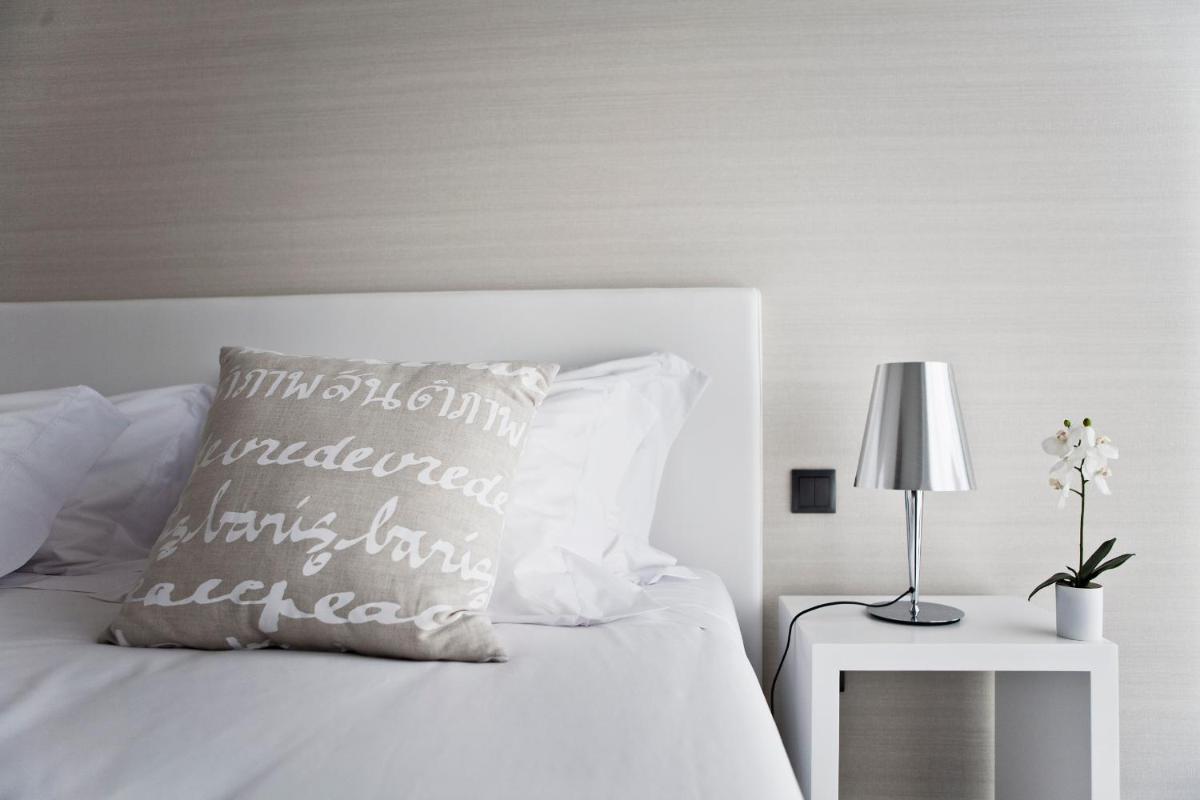 Uma cama ou camas num quarto em Real Abadia, Congress & Spa Hotel