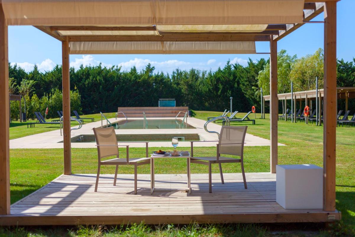 Jardín al aire libre en URH - Hotel Molí del Mig