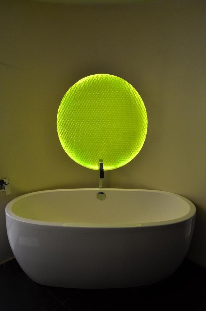 a light on top of a white bath tub at The Park Hyderabad, Banjara Hills near Hussain Sagar Lake in Hyderabad a light on top of a white bath tub at The Park Hyderabad, Banjara Hills near Hussain Sagar Lake in Hyderabad