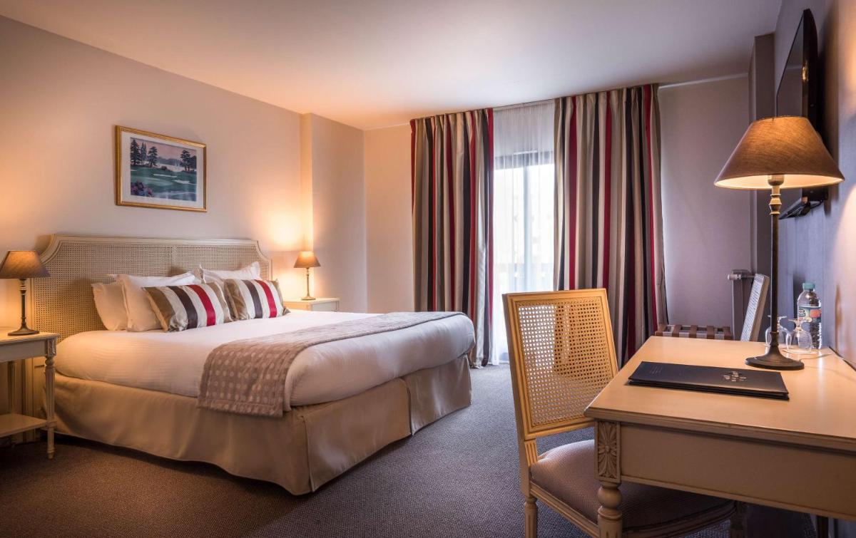 Un ou plusieurs lits dans un hébergement de l'établissement Best Western Plus Hostellerie Du Vallon