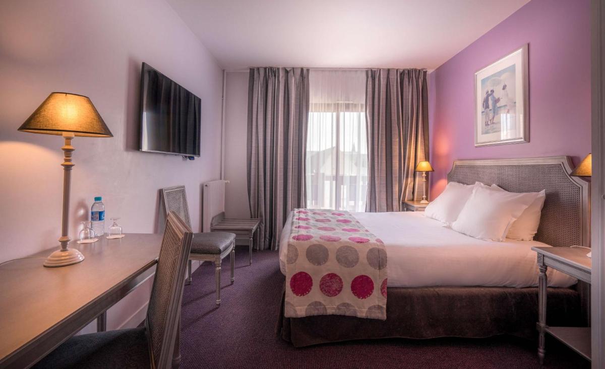 Un ou plusieurs lits dans un hébergement de l'établissement Best Western Plus Hostellerie Du Vallon