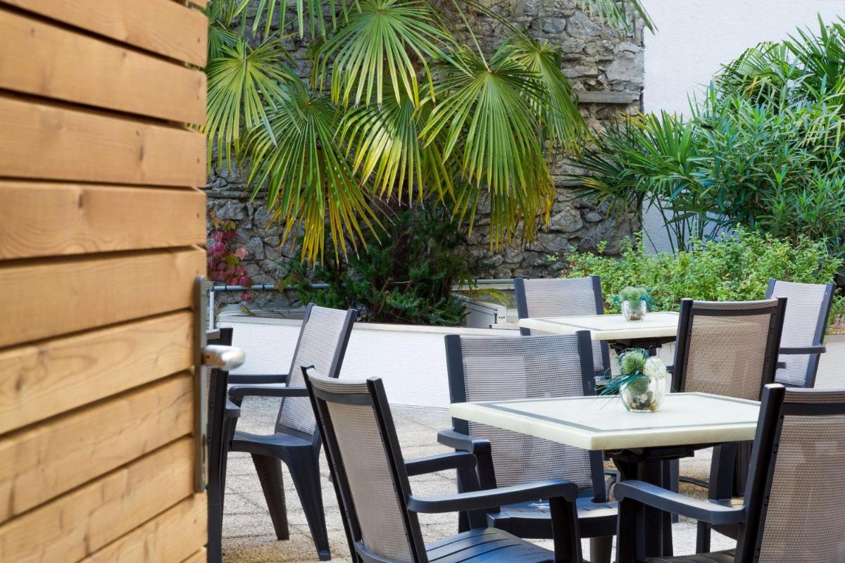 Jardin de l'établissement Hôtel Le Rive Droite & SPA