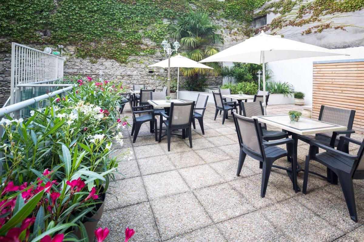 Jardin de l'établissement Hôtel Le Rive Droite & SPA