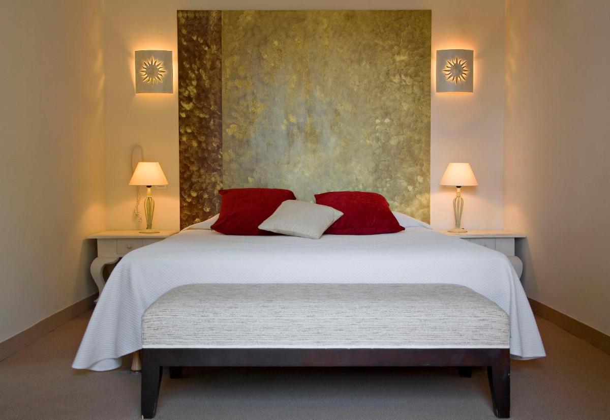 Un ou plusieurs lits dans un hébergement de l'établissement Le Cottage - Hotel & Spa