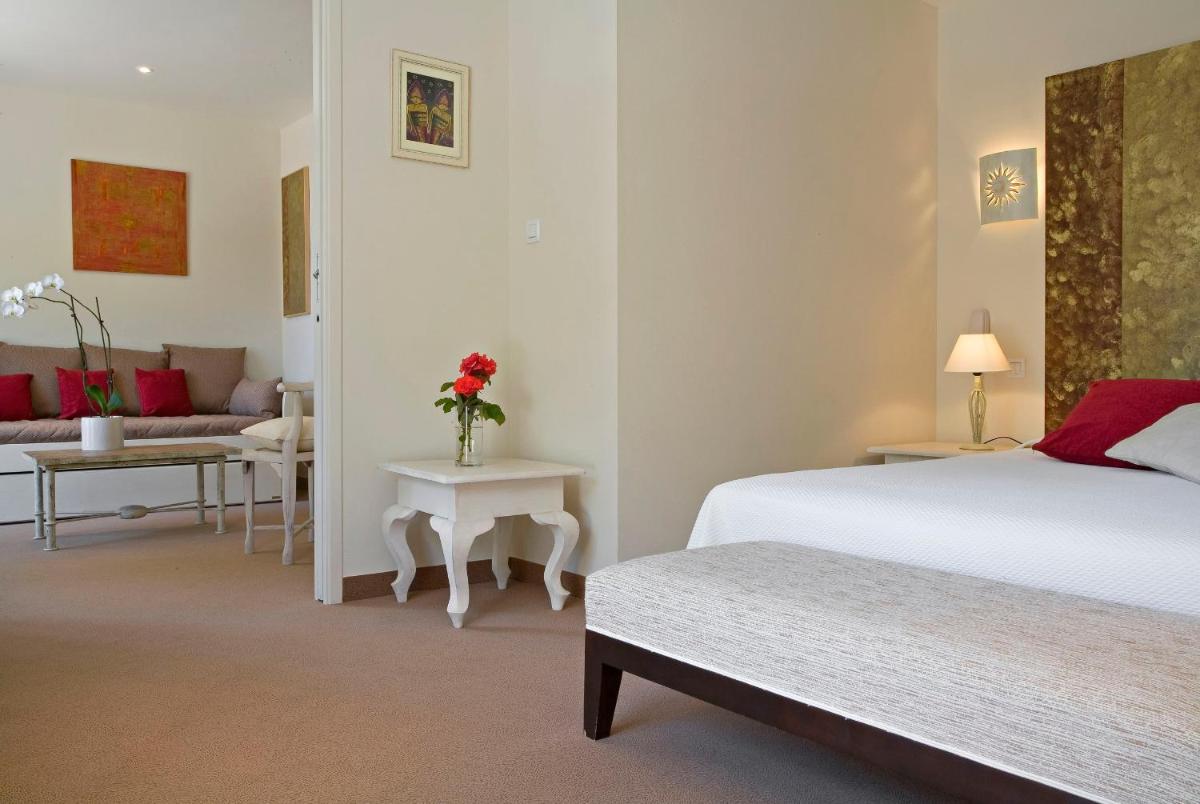 Un ou plusieurs lits dans un hébergement de l'établissement Le Cottage - Hotel & Spa