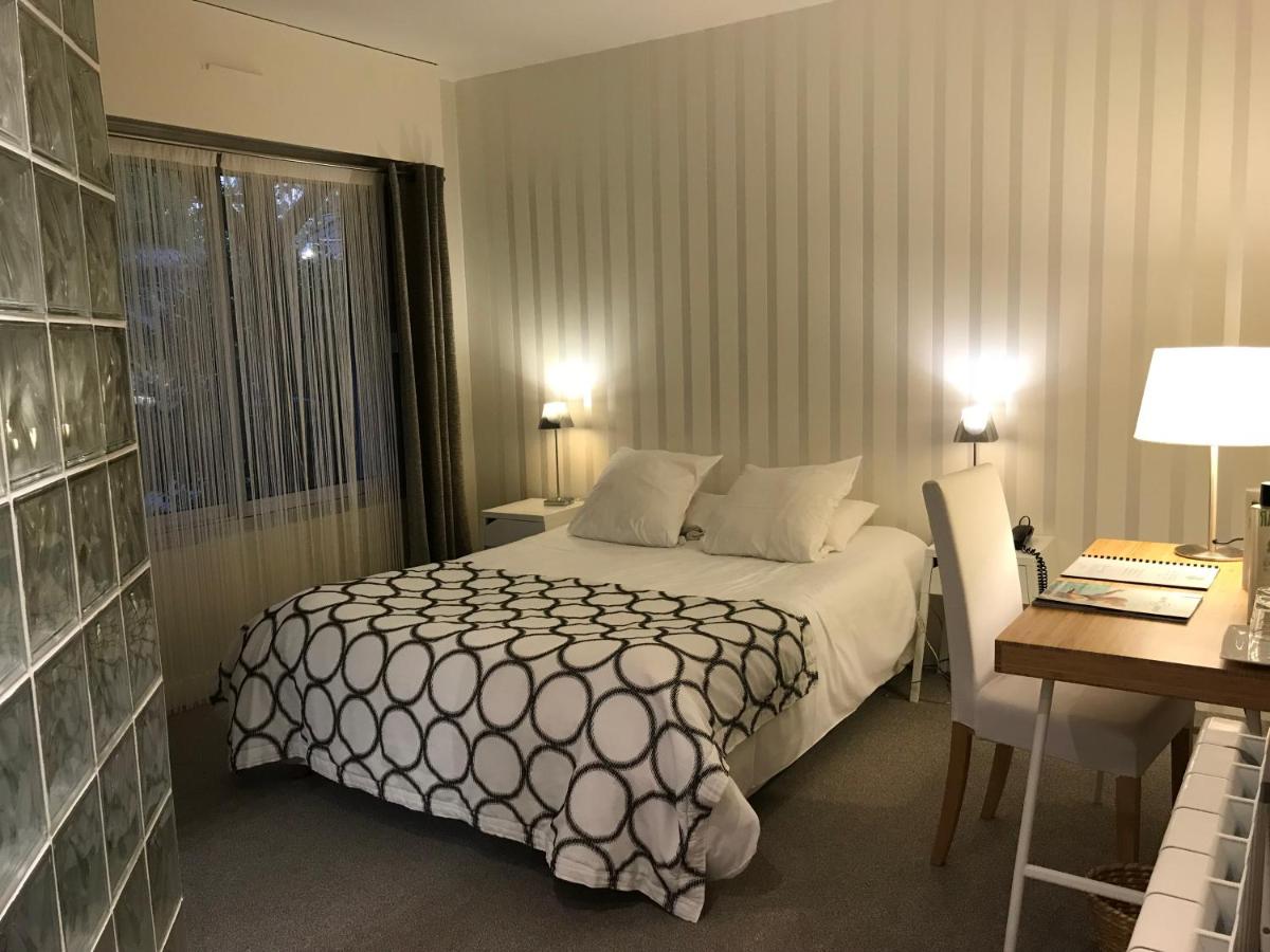 Un ou plusieurs lits dans un hébergement de l'établissement Carnac Lodge Hotel & Spa