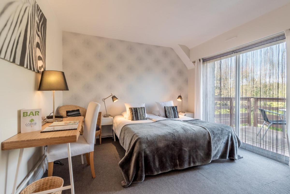 Un ou plusieurs lits dans un hébergement de l'établissement Carnac Lodge Hotel & Spa