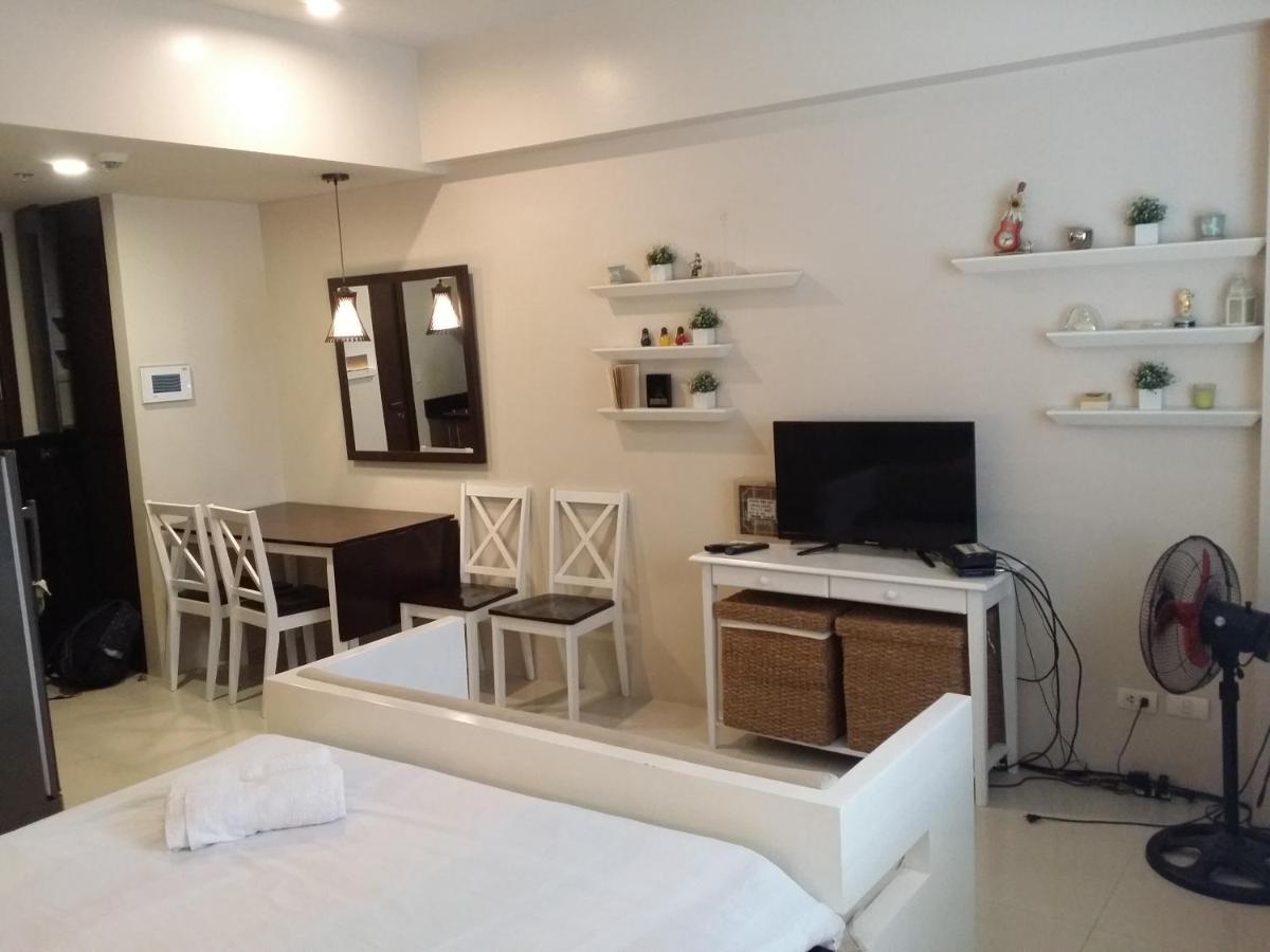 Palm Tree Condos across NAIA3 by Beth - Housity