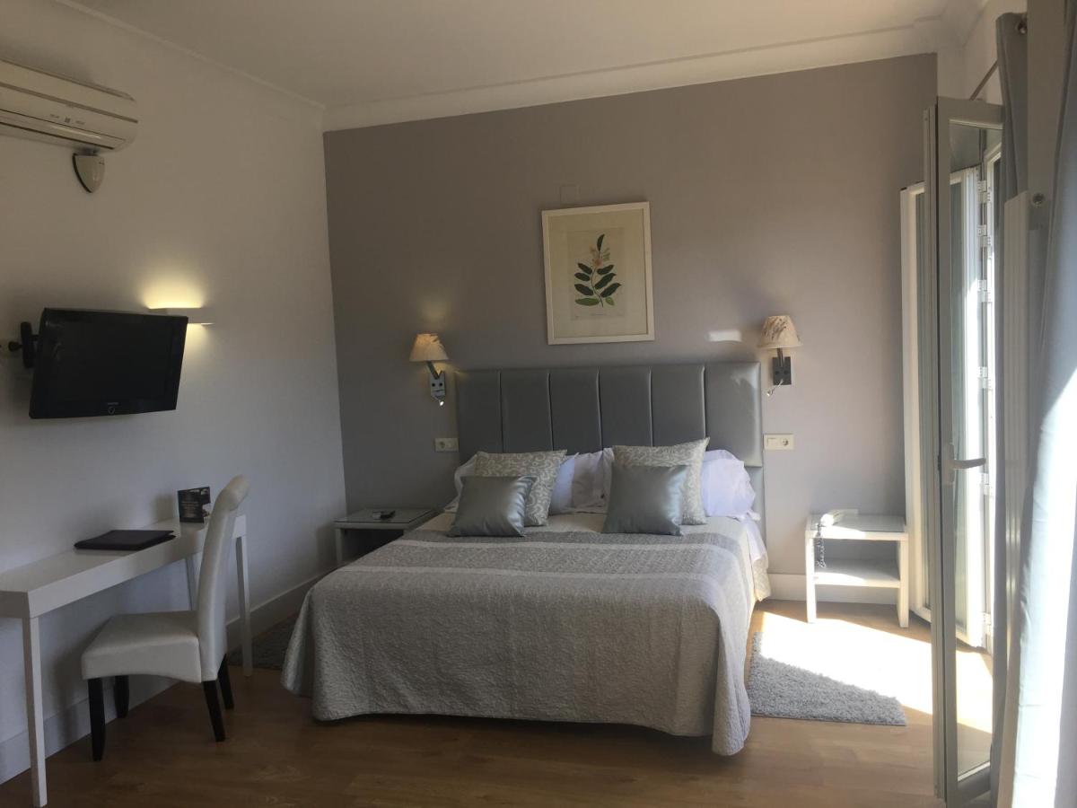 Cama o camas de una habitación en Hotel Leonor de Aquitania