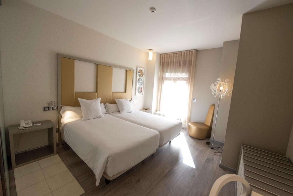 Cama o camas de una habitación en Hotel & Spa Princesa Munia