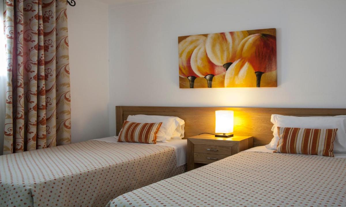 Uma cama ou camas num quarto em Jardim do Vau