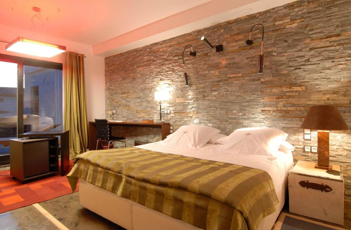 Cama o camas de una habitación en Hotel Casa del Abad