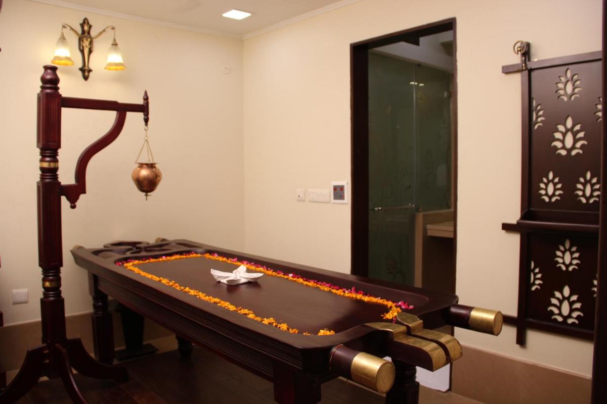 a room with a pool table and a mirror at Shahpura House in Jaipur