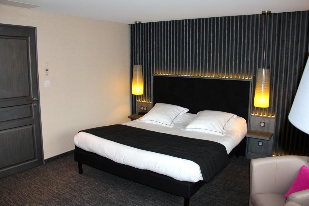 Un ou plusieurs lits dans un hébergement de l'établissement Hotel de la Jamagne & Spa