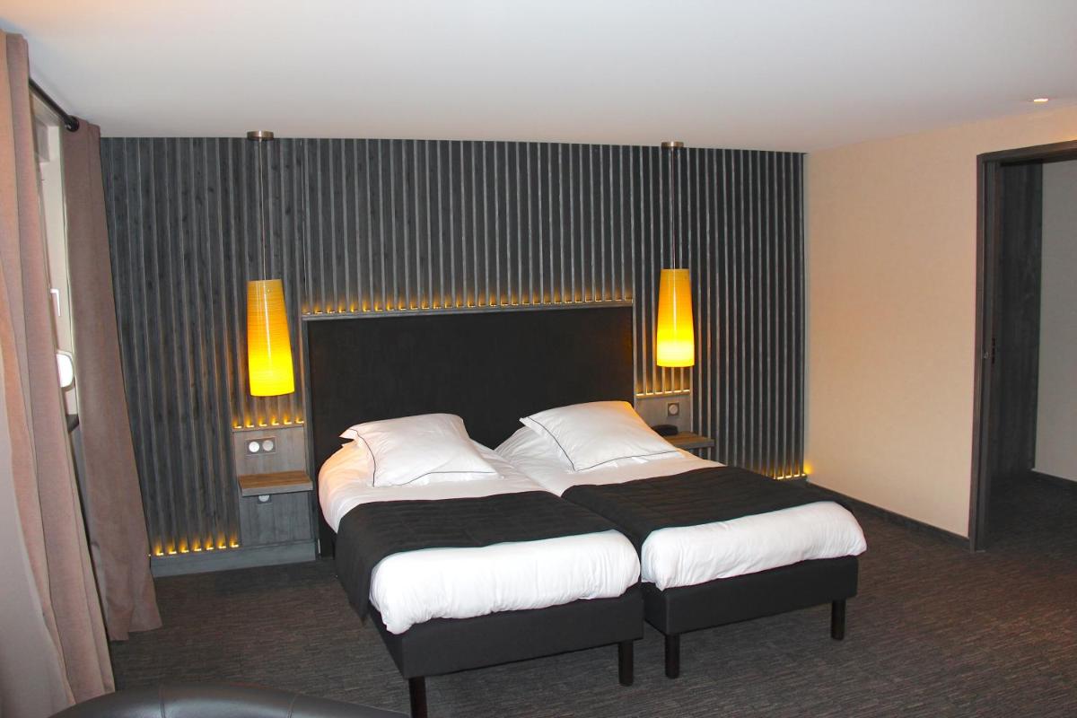Un ou plusieurs lits dans un hébergement de l'établissement Hotel de la Jamagne & Spa