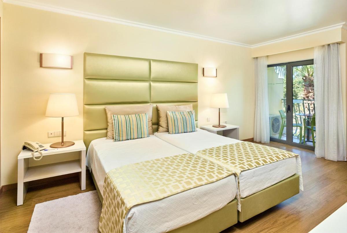 Uma cama ou camas num quarto em Hotel Baia Grande
