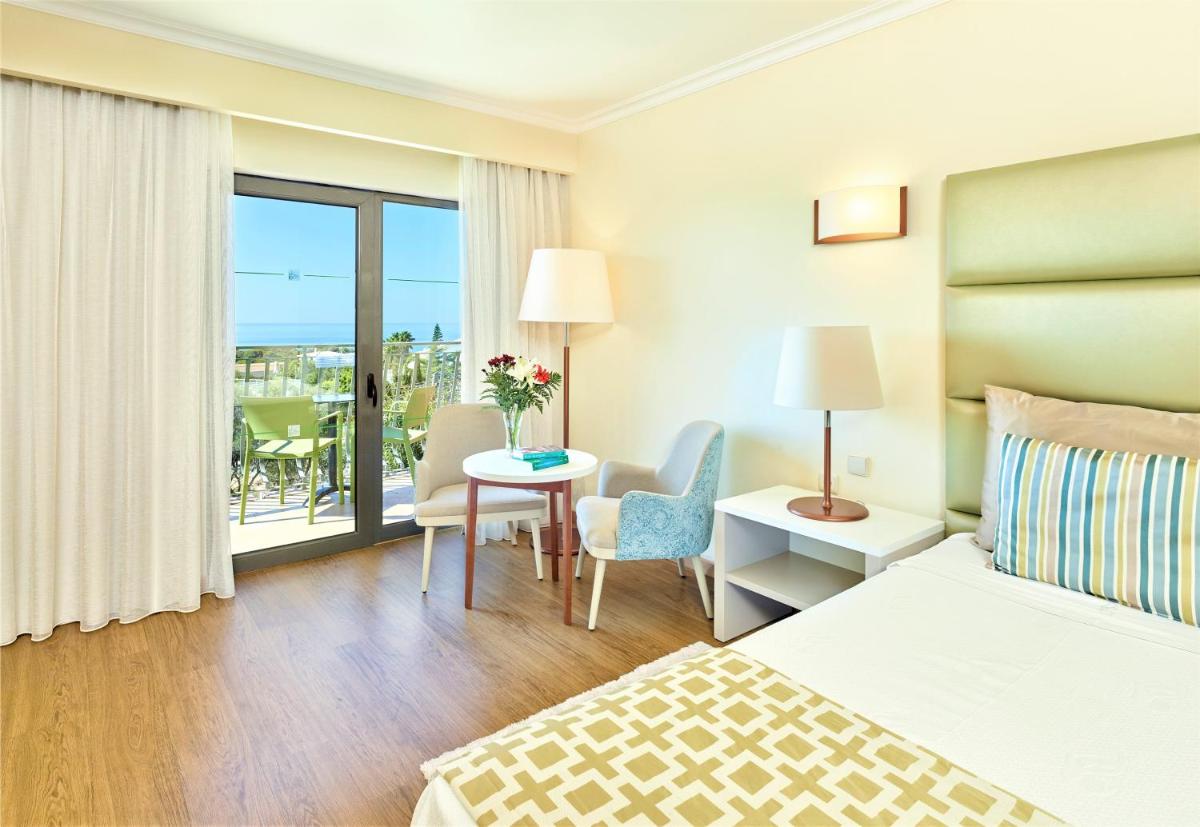 Uma cama ou camas num quarto em Hotel Baia Grande
