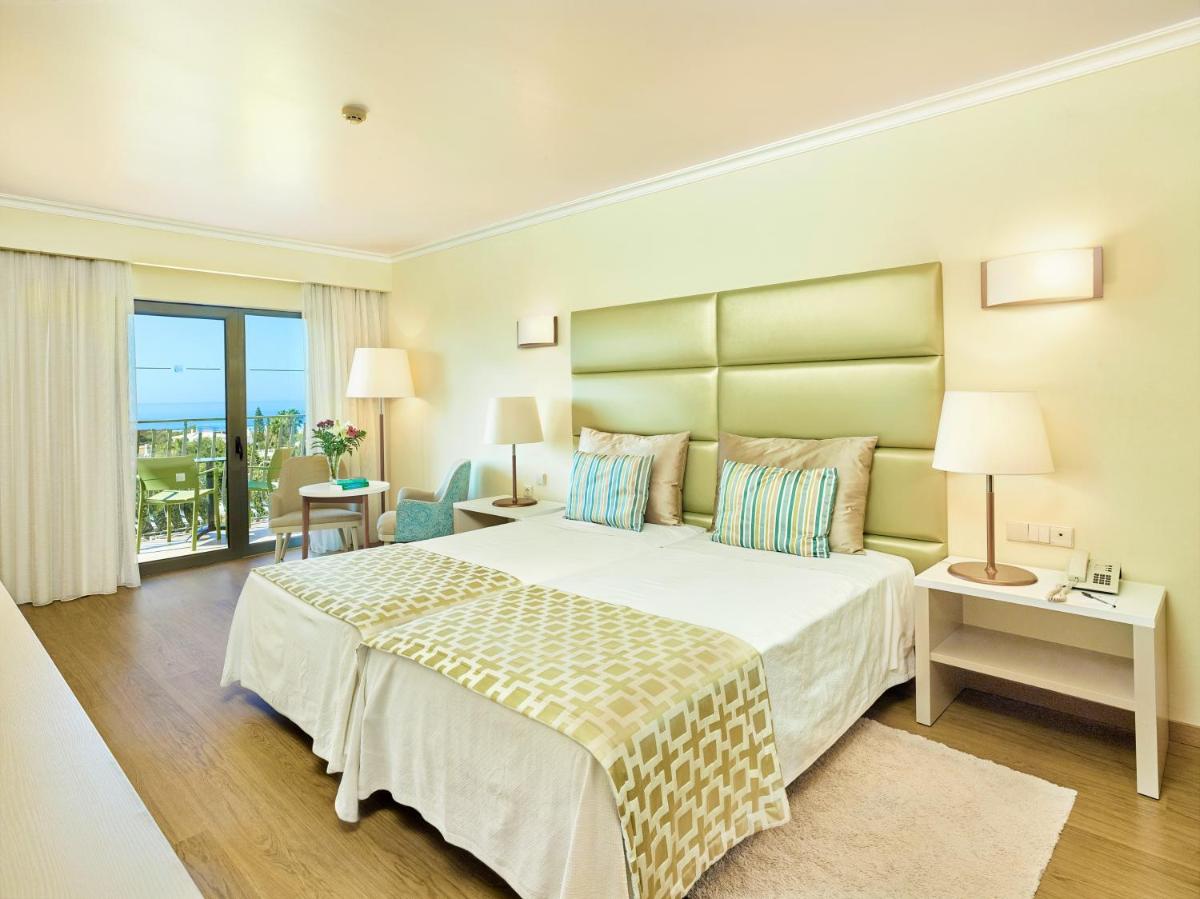 Uma cama ou camas num quarto em Hotel Baia Grande