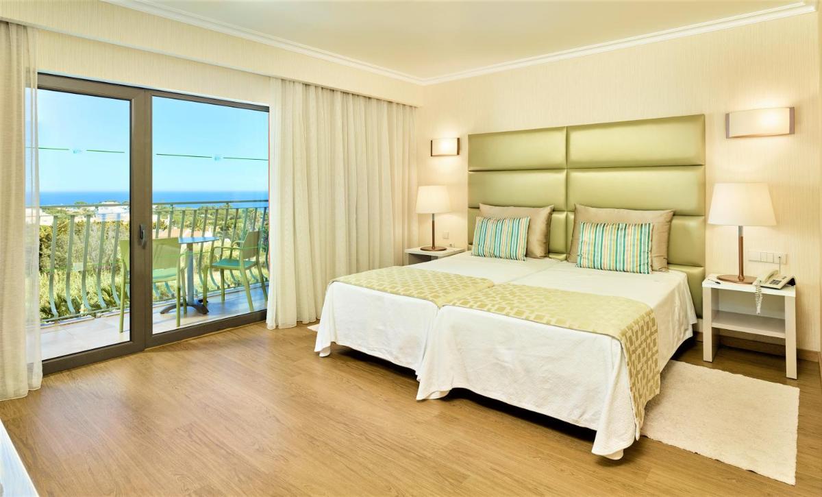 Uma cama ou camas num quarto em Hotel Baia Grande