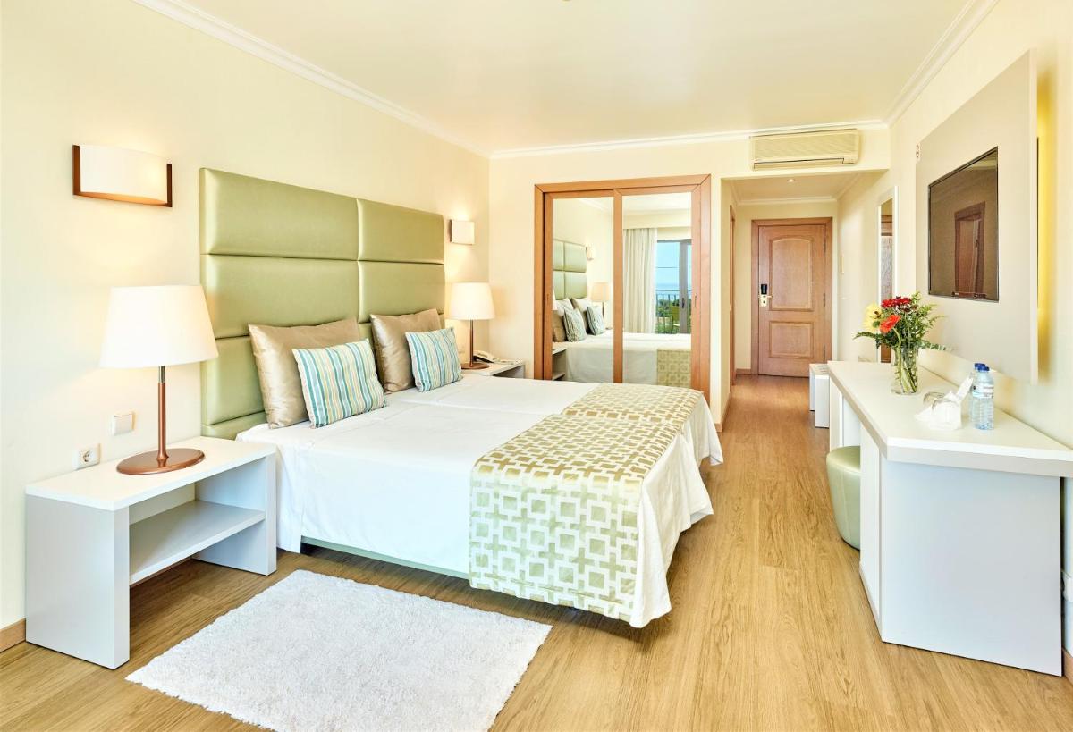 Uma cama ou camas num quarto em Hotel Baia Grande