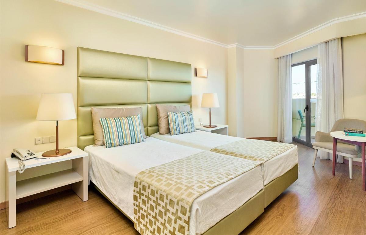 Uma cama ou camas num quarto em Hotel Baia Grande