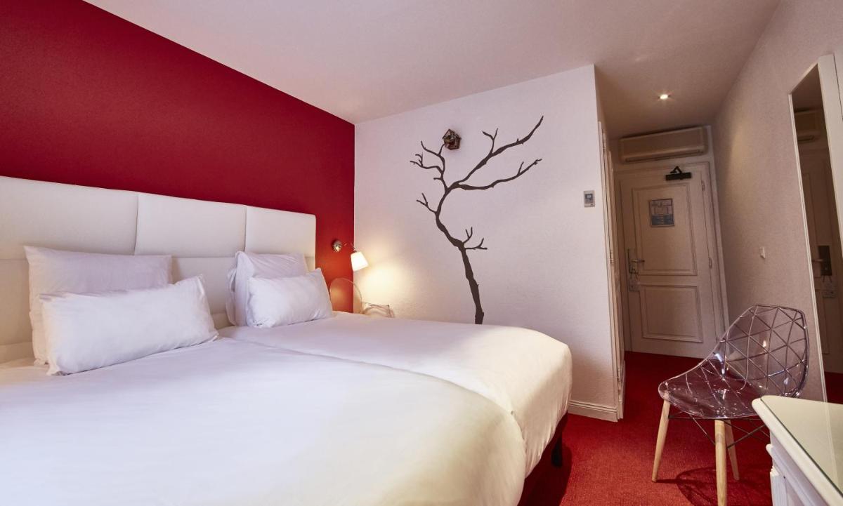 Un ou plusieurs lits dans un hébergement de l'établissement Best Western Plus Au cheval Blanc à Mulhouse