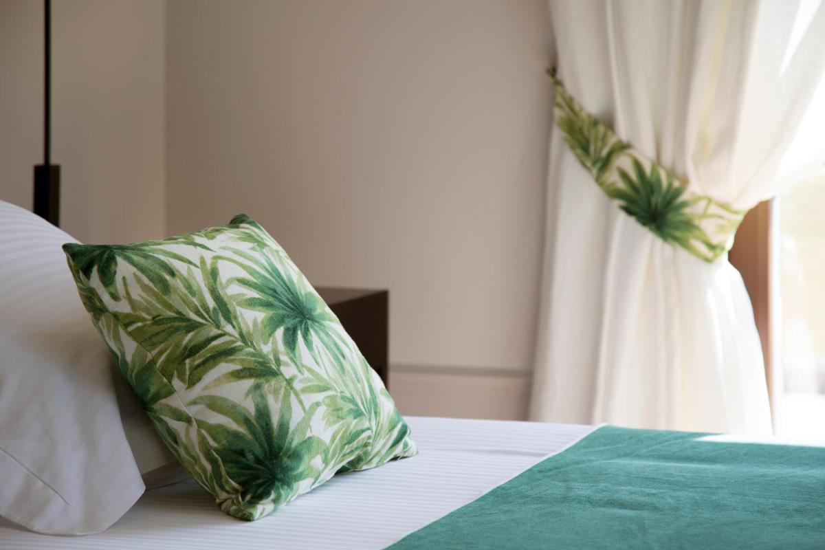 Cama o camas de una habitación en Casa Anamaria Hotel