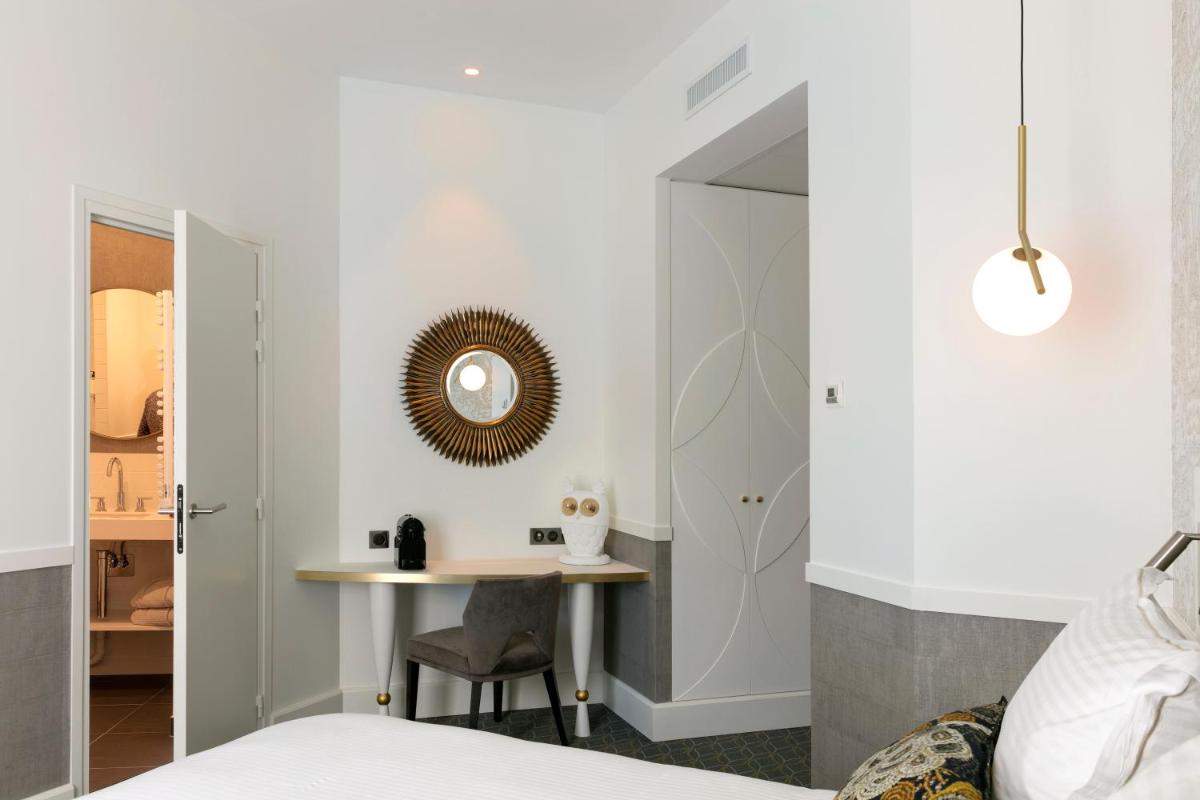 Un ou plusieurs lits dans un hébergement de l'établissement Continental Hotel