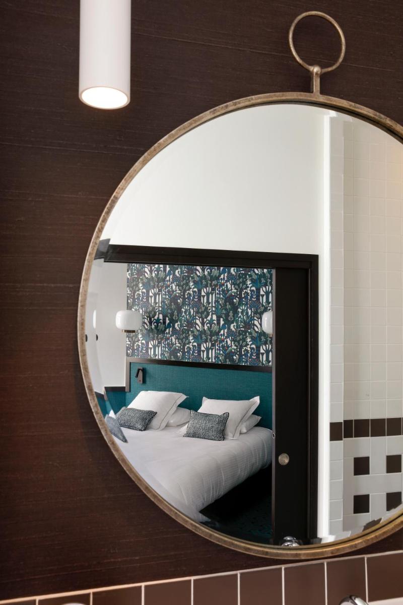 Un ou plusieurs lits dans un hébergement de l'établissement Continental Hotel