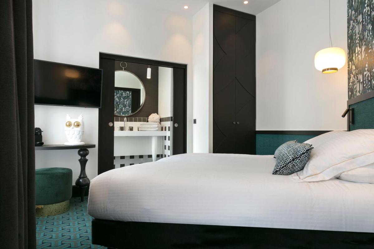 Un ou plusieurs lits dans un hébergement de l'établissement Continental Hotel