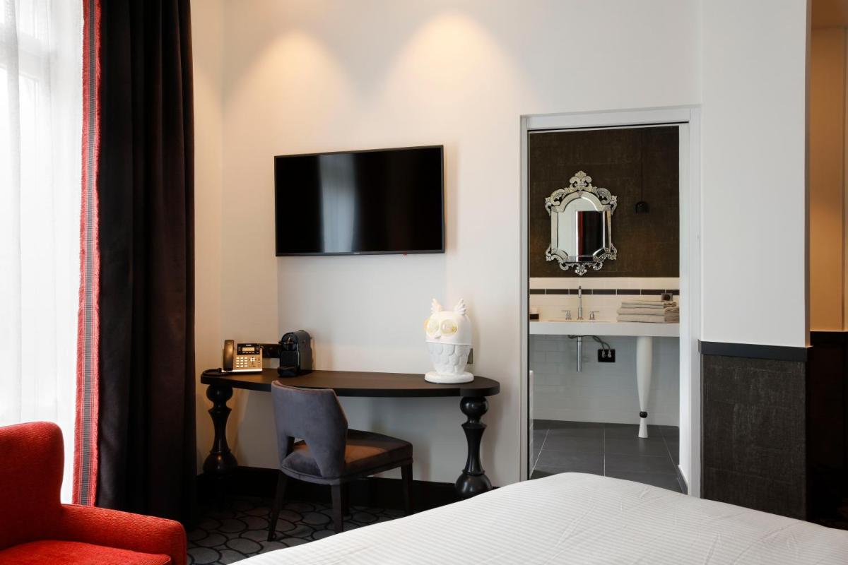 Un ou plusieurs lits dans un hébergement de l'établissement Continental Hotel