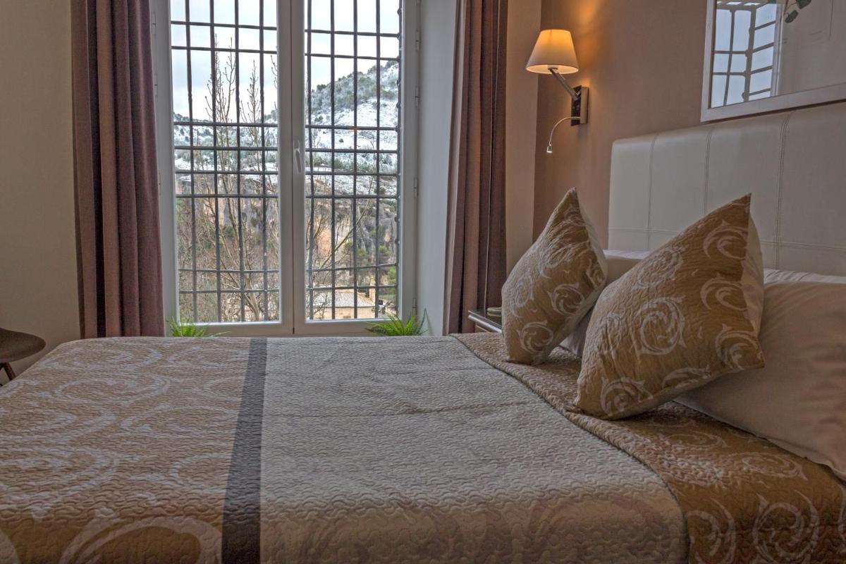 Cama o camas de una habitación en Hotel Leonor de Aquitania